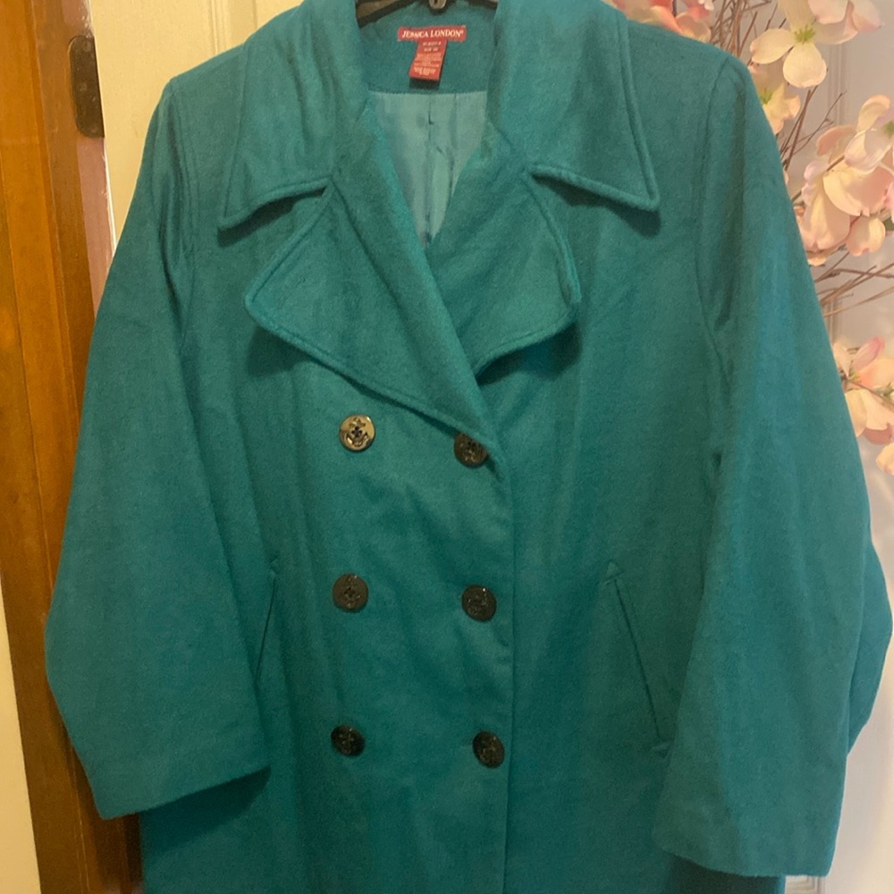 Beautiful turquoise coat. Brand new, no tags. Pockets are still sealed. Size 20